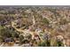 This aerial view captures a well-planned neighborhood with houses nestled among mature trees at 102 Kamprath Pl, Cary, NC 27519