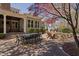 Outdoor patio with comfortable dining area and adjacent stone fire pit with adirondack chairs at 102 Kamprath Pl, Cary, NC 27519