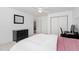 Cozy bedroom featuring a black dresser and a built-in desk with a comfortable chair, and a neutral color scheme at 102 Kamprath Pl, Cary, NC 27519
