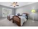 Shared bedroom featuring two twin beds, a ceiling fan, and a window that offers great natural light at 102 Kamprath Pl, Cary, NC 27519