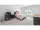 Bright bedroom with a ceiling fan, a bed with pink accents, and a modern desk setup, creating a comfortable retreat at 102 Kamprath Pl, Cary, NC 27519