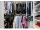 Walk-in closet featuring ample hanging space and built-in shelving for optimal organization at 102 Kamprath Pl, Cary, NC 27519