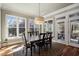 Elegant dining room with pendant lighting and views of the outdoors at 102 Kamprath Pl, Cary, NC 27519