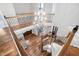 Elegant foyer with hardwood floors, ornate chandelier, and wrought iron railing staircase at 102 Kamprath Pl, Cary, NC 27519