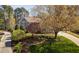 Beautifully landscaped front yard with a large tree and well-maintained lawn at 102 Kamprath Pl, Cary, NC 27519