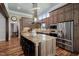 Spacious kitchen features a large island, stainless steel appliances and custom cabinetry at 102 Kamprath Pl, Cary, NC 27519