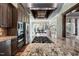 Kitchen island with gas cooktop, stainless steel appliances, and granite countertops at 102 Kamprath Pl, Cary, NC 27519