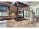 Close-up of kitchen island with gas cooktop and stainless steel vent hood at 102 Kamprath Pl, Cary, NC 27519