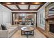 Open-concept living room with fireplace and view into the kitchen at 102 Kamprath Pl, Cary, NC 27519