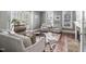 Comfortable living room with ample seating, natural light, and fireplace at 102 Kamprath Pl, Cary, NC 27519