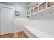 Mudroom with built-in bench and storage cubbies with hooks to keep organized at 102 Kamprath Pl, Cary, NC 27519