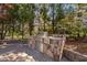 Outdoor grill area with stainless steel grill, stone counter, and brick paver patio at 102 Kamprath Pl, Cary, NC 27519