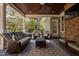 Relaxing covered outdoor patio area, complete with comfortable seating and a ceiling fan at 102 Kamprath Pl, Cary, NC 27519