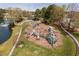 Community playground with multiple slides, climbing structures, and other play features, creating a fun recreational area at 102 Kamprath Pl, Cary, NC 27519