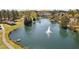 The image displays a serene pond with a fountain, gazebo and park amenities at 102 Kamprath Pl, Cary, NC 27519