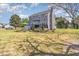View of back of house, showing deck and landscaping, including picnic table and lawn at 1020 Retriever Ln, Raleigh, NC 27603