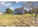 View of back of house, showing deck and landscaping, including picnic table and lawn at 1020 Retriever Ln, Raleigh, NC 27603