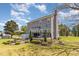 Generous backyard with gray house, deck, and picnic area, ideal for entertaining and relaxation at 1020 Retriever Ln, Raleigh, NC 27603