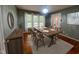 Dining room featuring a dark wood table, seating for six, and lots of light at 1020 Retriever Ln, Raleigh, NC 27603