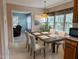 Dining room featuring a dark wood table, seating for six, and views to living room at 1020 Retriever Ln, Raleigh, NC 27603