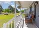 Cozy front porch featuring comfortable wicker furniture, hanging plants, and ample space for relaxation at 1020 Retriever Ln, Raleigh, NC 27603
