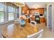 Bright eat-in kitchen with wood table, white chairs, and natural light at 1020 Retriever Ln, Raleigh, NC 27603