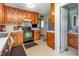 Kitchen showcasing wood cabinetry and black appliances at 1020 Retriever Ln, Raleigh, NC 27603