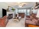 Cozy living room with a fireplace, plush sofas, and plenty of natural light at 1020 Retriever Ln, Raleigh, NC 27603