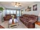 Cozy living room with a ceiling fan, comfortable seating, and plenty of natural light at 1020 Retriever Ln, Raleigh, NC 27603