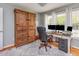 Home office space with wooden desk and ample storage at 1020 Retriever Ln, Raleigh, NC 27603