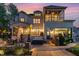 Spacious backyard featuring a patio with a hot tub, outdoor dining area, and covered porch at 104 Vervain Way, Holly Springs, NC 27540