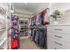 Organized walk-in closet with custom shelving and ample hanging space, providing stylish storage at 104 Vervain Way, Holly Springs, NC 27540