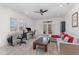 Spacious home office with ample natural light and comfortable seating area at 104 Vervain Way, Holly Springs, NC 27540