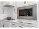 Modern kitchen details: stainless steel microwave and gas cooktop at 104 Vervain Way, Holly Springs, NC 27540