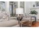 Cozy sitting area with cushioned chairs, providing natural light and an airy feel at 104 Vervain Way, Holly Springs, NC 27540