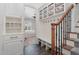 Hallway features a mudroom with built-in shelving, and a view into the bedroom at 104 Vervain Way, Holly Springs, NC 27540