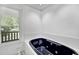 Bathroom featuring an inset black jetted tub with a window view at 105 Hobson Pl, Louisburg, NC 27549