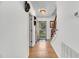 Bright foyer features hardwood floors, a staircase and a view of the front door at 105 Hobson Pl, Louisburg, NC 27549