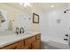 Bright bathroom with a shower and tub combo, stylish fixtures, and decorative wall art at 11 Swallow Tail Ct, Pittsboro, NC 27312