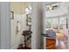 Powder room leading into a primary bedroom featuring an ornate bowl sink and hardwood flooring at 11 Swallow Tail Ct, Pittsboro, NC 27312
