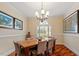 Dining room with chandelier, hardwood floors, and natural light at 11 Swallow Tail Ct, Pittsboro, NC 27312