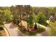Beautiful home with mature trees, lush landscaping, and circular driveway at 11 Swallow Tail Ct, Pittsboro, NC 27312