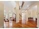 Grand foyer featuring hardwood floors, staircase, and open floor plan at 11 Swallow Tail Ct, Pittsboro, NC 27312