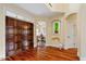 Grand foyer entrance with hardwood floors and wooden front door at 11 Swallow Tail Ct, Pittsboro, NC 27312