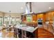 Spacious kitchen with stainless steel hood and kitchen island at 11 Swallow Tail Ct, Pittsboro, NC 27312