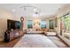 Cozy living room with a comfortable sofa, large rug, and access to outdoor deck area at 11 Swallow Tail Ct, Pittsboro, NC 27312