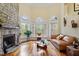 Bright living room with stone fireplace and hardwood floors at 11 Swallow Tail Ct, Pittsboro, NC 27312