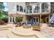 Charming patio with an outdoor kitchen, lounge furniture, and a cozy fireplace at 11 Swallow Tail Ct, Pittsboro, NC 27312