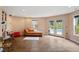Open recreation room with pool view, comfortable seating, and access to the outdoor area at 11 Swallow Tail Ct, Pittsboro, NC 27312