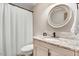 Bathroom featuring vanity, granite counters, and a shower with a white shower curtain at 1149 Us-701 Hwy, Four Oaks, NC 27524